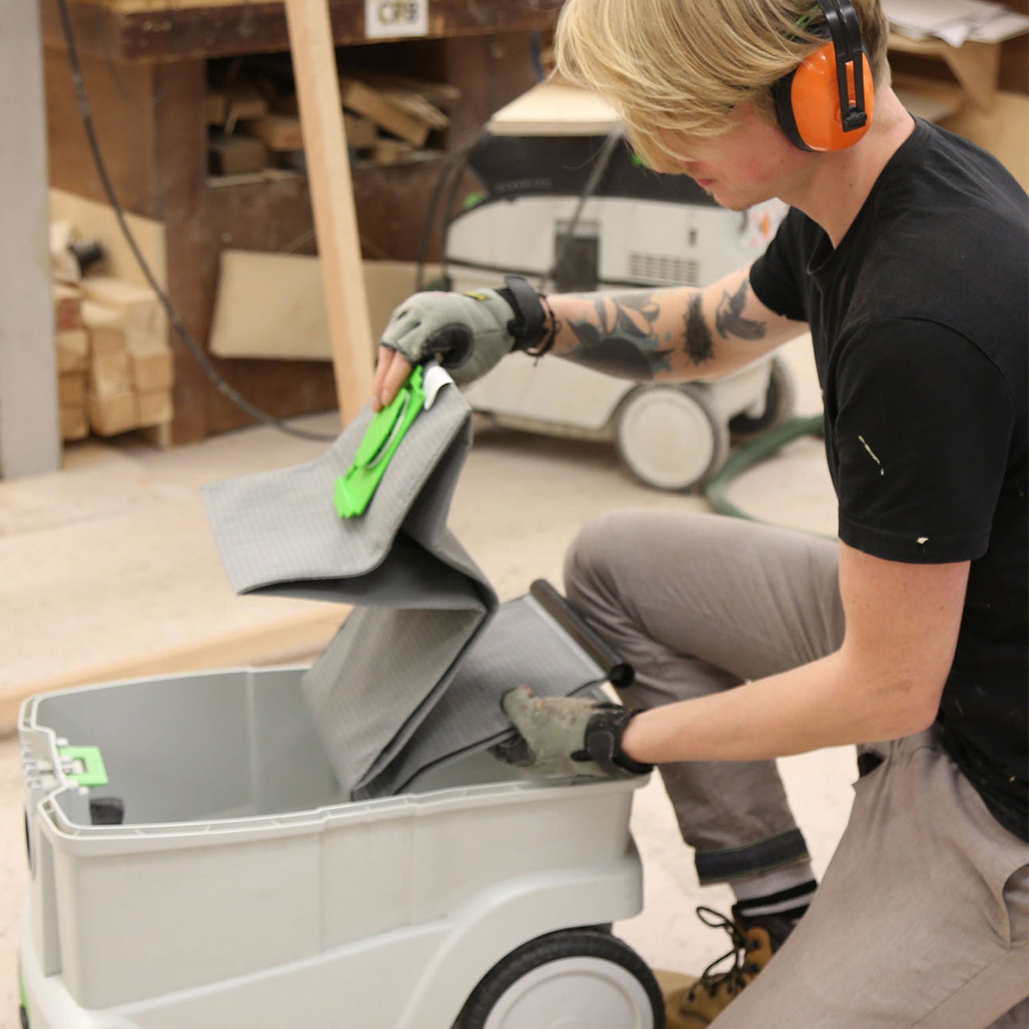 Workshop carpenter is fitting Macam CT-26 bag to Festool CTL 26 AC dust extractor